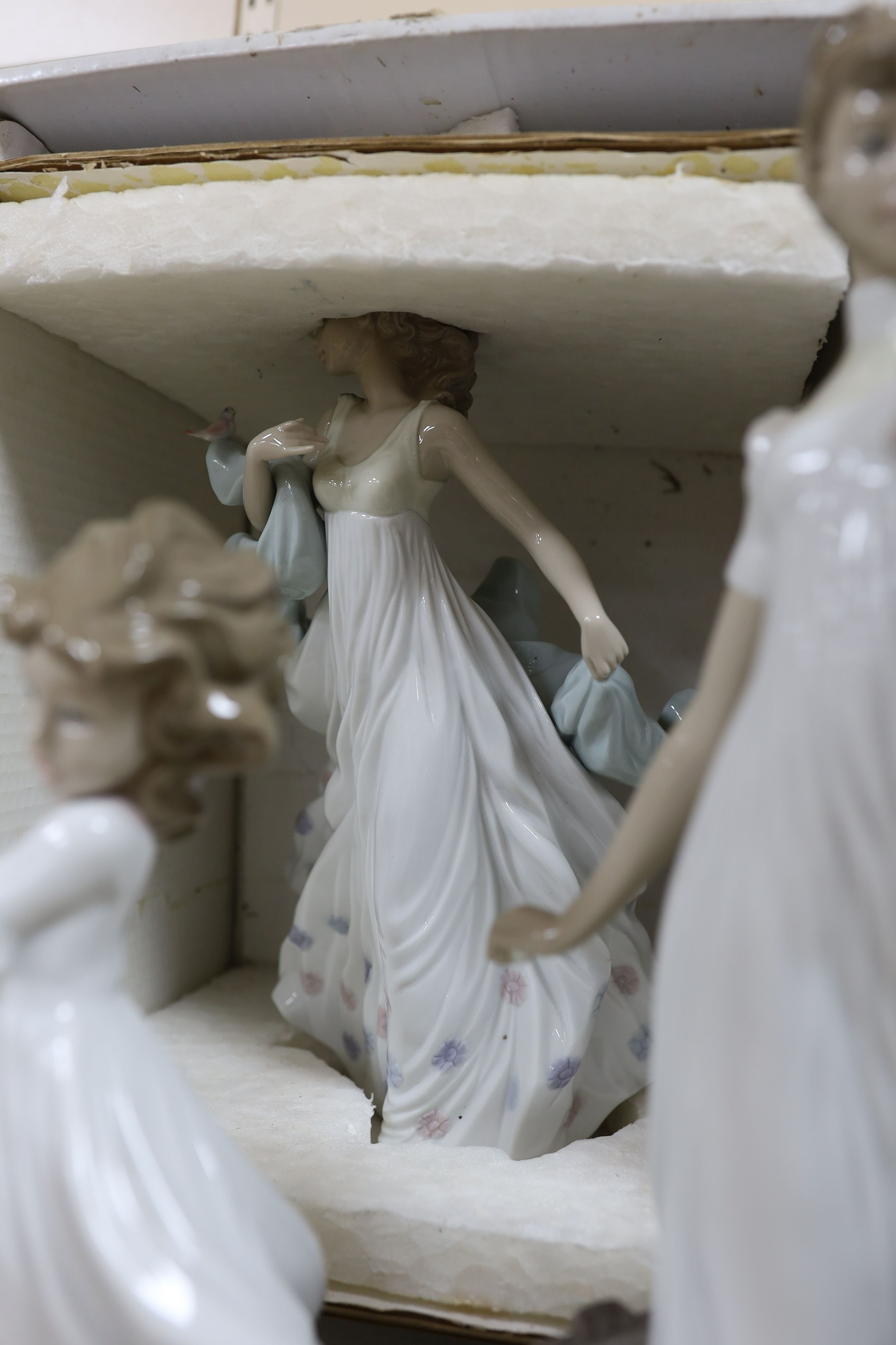 A selection of Lladro and Nao figures